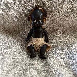 Small Black Composition Doll with Cream Cloth Shorts